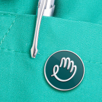 Closeup with stethoscope and pen in scrubs pocket